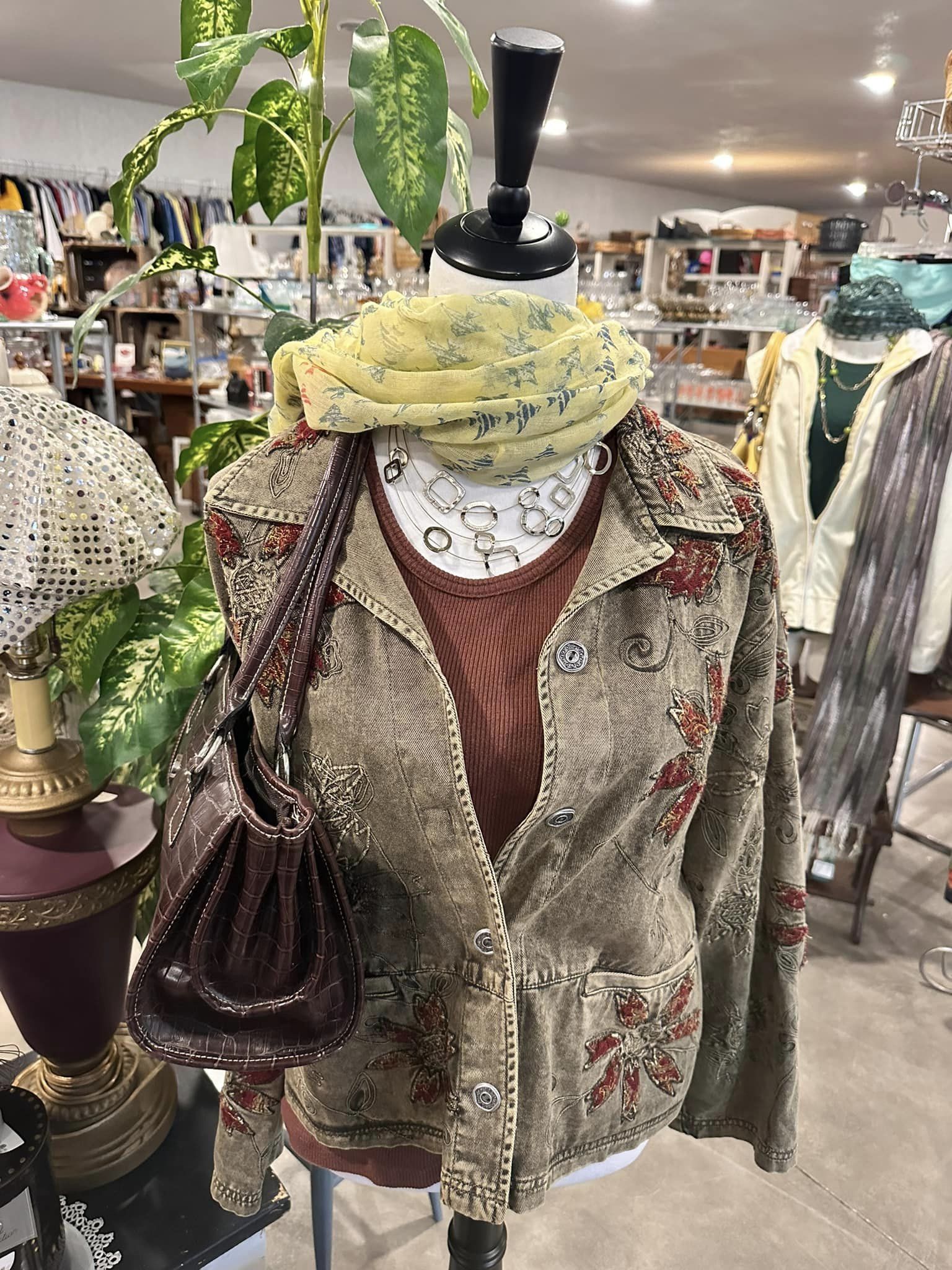 A styled clothing display inside The Bridge Thrift Store